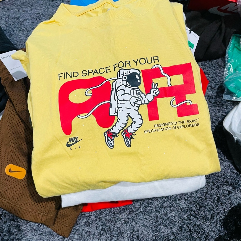 Nike Air Yellow Tee with Astronaut Graphic